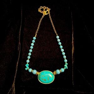 Chico’s faux turquoise and gold trim necklace.